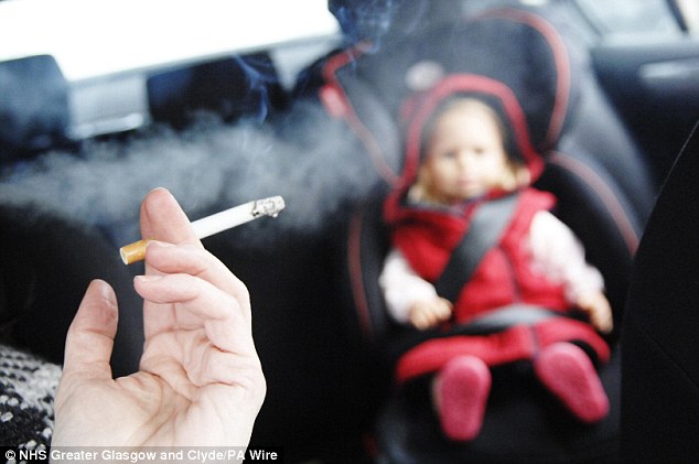 Danger: A judge ruled that his parents' smoking was damaging to the little boy (picture posed by models) 