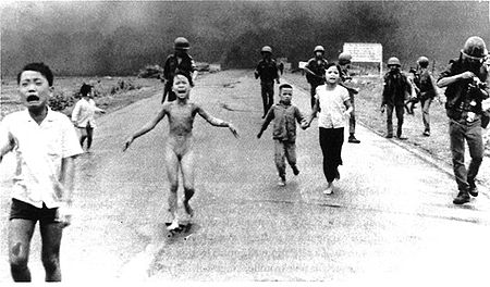 8 June 1972: Kim Phc, center left, running down a road near Trang Bang after a South Vietnamese Air Force napalm attack.