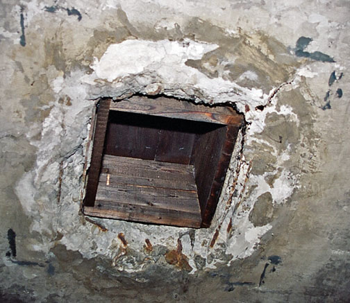 Holes put in by Russians, turning a morgue, then air raid shelter into a 'gas chamber'.  Crude beyond belief.