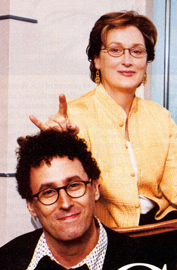 Actress Meryl Streep gives the sign of the Devil just over the head of “Angels in America” director, Mike Nichols.