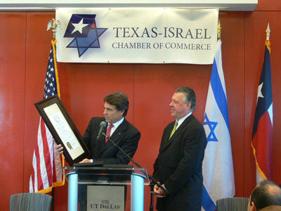 Governor Perry receives an award from the Texas-Israel Chamber of Commerce, a private Zionist business organization Perry established in September 2007.  A glance at the board members of Perry's group of Israeli supporters reveals the heads of two of Mossad's biggest intelligence gathering companies in the United States:  Amdocs and Elbit.  Elbit (a military subsidiary of Elron) is directly involved in stealing presidential elections in the United States through its control of the tally of the Iowa caucus.
